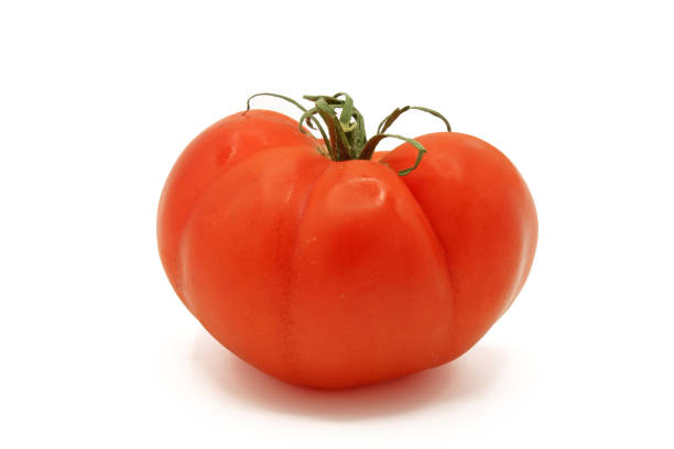 istock A whole salad tomatoes isolated on a white background 1362342646