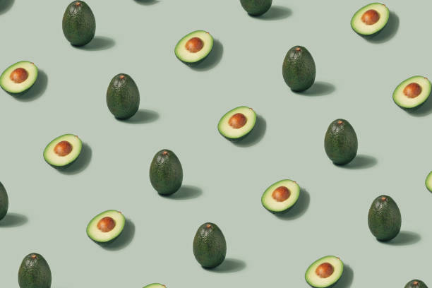 istock Avocado layout on a pastel green background. 1362343493