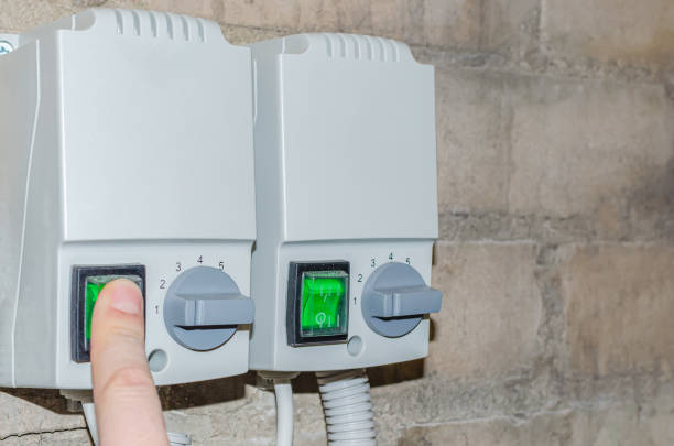 istock The person's finger turns on the green button to put the heating system into production 1362344347
