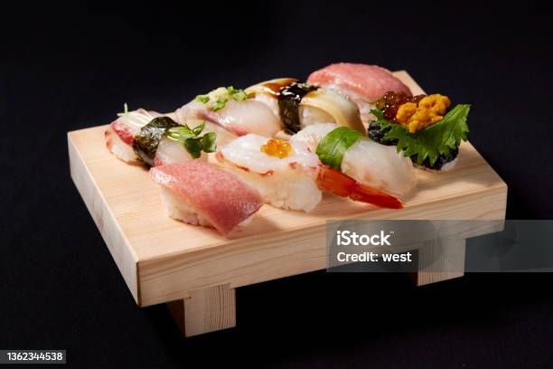 A Delicious Grip Sushi Riding On The Geta Stock Photo - Download Image Now - Sushi, Nigiri, Geta Sandal