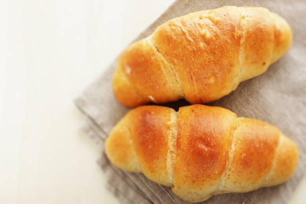 istock Salt and butter bread on wooden board with milk tea 1362345659