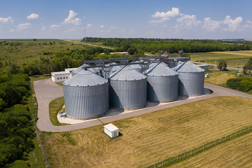 Aerial view of agricultural silos, grain elevator for storage and drying of cereals