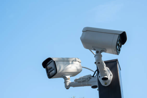 two monitoring machines on the roadside under the blue sky - organized crime flash imagens e fotografias de stock