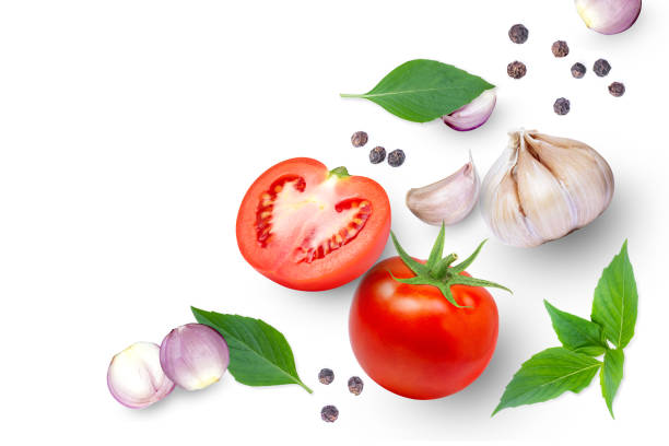 istock Tomato with basil leaves, garlic, onion and black pepper isolated on white background. 1362346418