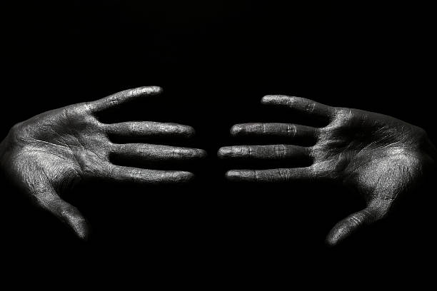 istock beautiful male hands in silver paint 136234844