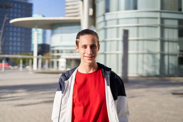 istock Student guy smiling at camera outdoors on campus of university 1362349117