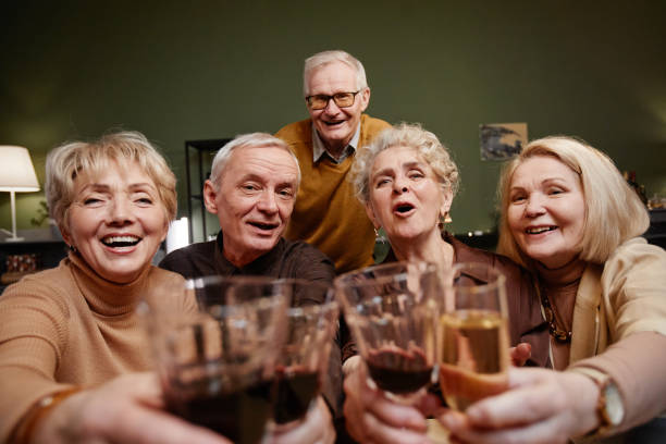 istock Old friends clinking wine glasses 1362353806