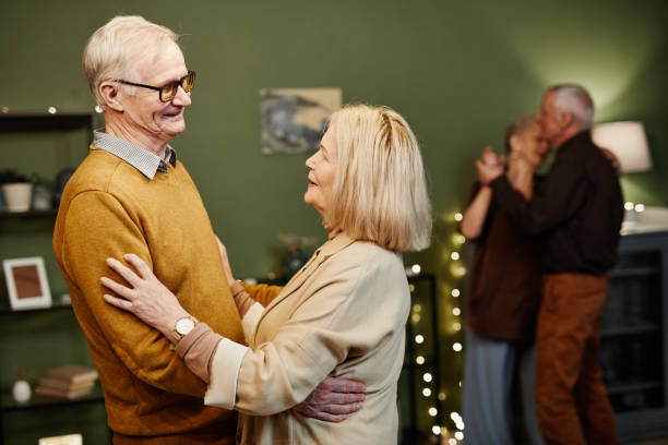 istock Old man and woman dancing indoors 1362353823