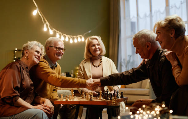 istock Seniors playing chess during meeting 1362353859