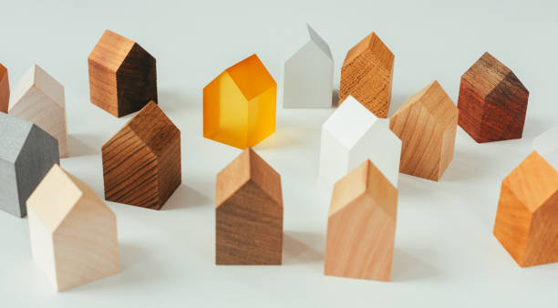 istock Group of similar wooden tiny toy houses. 1362356310