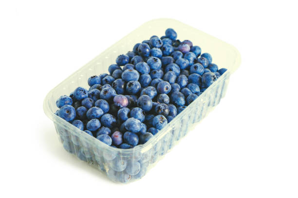 istock Fresh ripe organic blueberries in transparent container isolated on white 1362372452