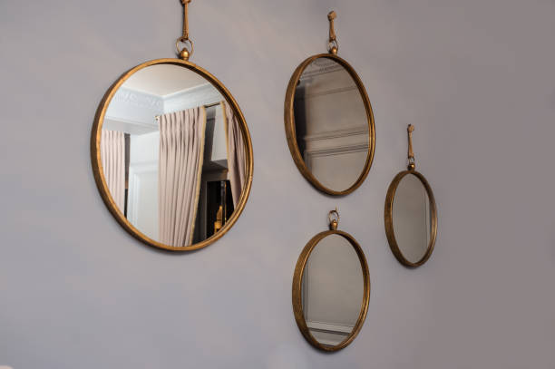istock Close up round mirrors on a gray wall. 1362374816