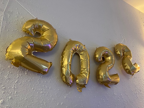 Balloon banner on wall for New Year reading 2022