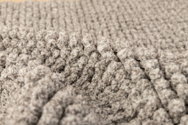 istock Gray chenille soft bath mat texture background. Bath Accessories. Top view. 1362378611