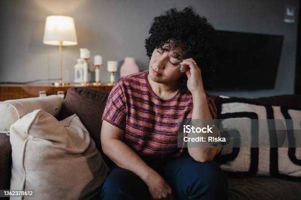Portrait Of Mid Adult Woman Feeling Depressed Stock Photo - Download Image Now - Women, One Woman Only, Tired
