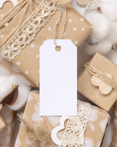 istock Valentines present with blank gift tag and heart close up, Rustic label Mockup 1362379463