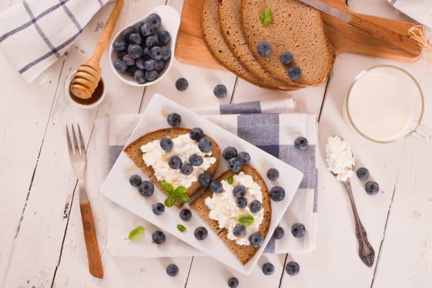 istock Rye bread with cottage cheese, blueberries and honey. 1362380875