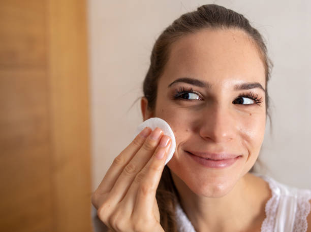 istock Young Woman Removing Makeup 1362385656