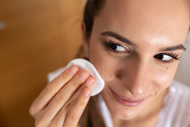 istock Young Woman Removing Makeup 1362385661