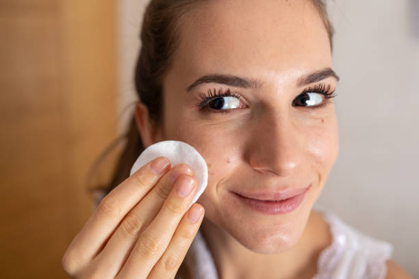 istock Young Woman Removing Makeup 1362385663