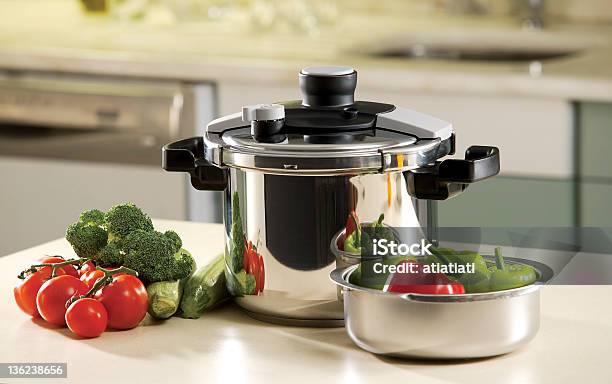 Pressure Cooker On A Counter With Fresh Vegetables Stock Photo - Download Image Now - Pressure Cooker, Food, Cooking