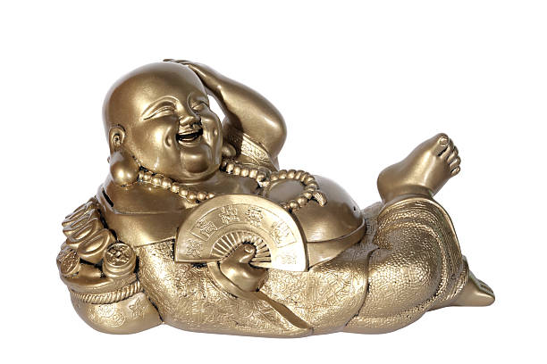 Statuette of Hotei (Buddha) with a fan on the white background.