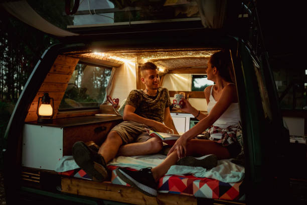 istock Young couple with camper at road trip 1362388229