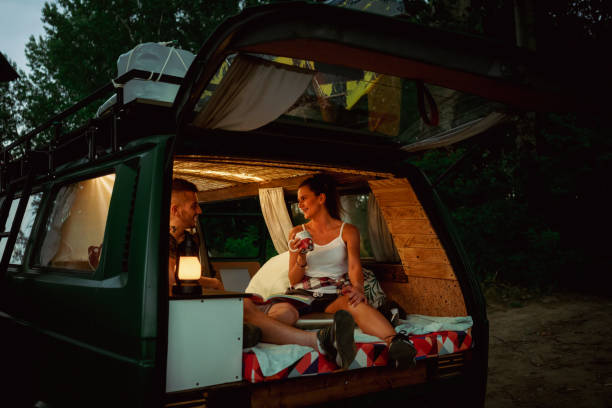 istock Young couple with camper at road trip 1362388233