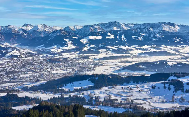 panoramic winter landscape in The Allgaeu Alps high above river Iller valley with sonthofen and Oberstdorf, Bavaria, Germany
