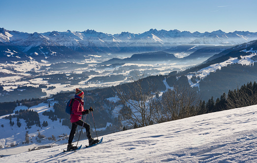 Skiers looking at Matterhorn mountain at Zermatt ski resort, Valais canton, Switzerland, in winter morning. Taken by Sony a7R II, 42 Mpix.