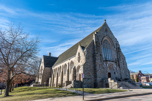 View of Church of Saint Ignatius of Loyola by Chestnut Hill Village, Massachusetts. The church is named after the founder of the Jesuit order, Ignatius of Loyola. It is run independently of the Archdiocese and is staffed by the Jesuits.