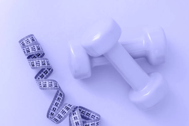 https://media.istockphoto.com/id/1362393925/photo/light-purple-dumbbells-with-a-centimeter-ribbon-on-the-background-of-the-color-very-peri-the.jpg?s=612x612&w=0&k=20&c=PSC1KAi0OGauBO5nWoPF920HPrmUJ_B3BRFNswZxMIQ=