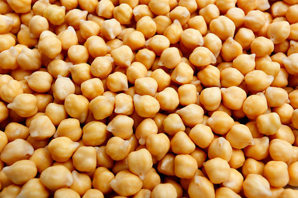 Chick-Peas soaked chick-peas or garbanzo beans chick pea photos stock pictures, royalty-free photos & images