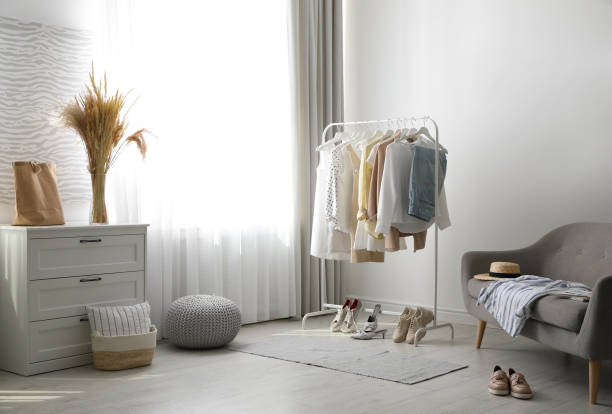 istock Dressing room interior with clothing rack and sofa 1362404918