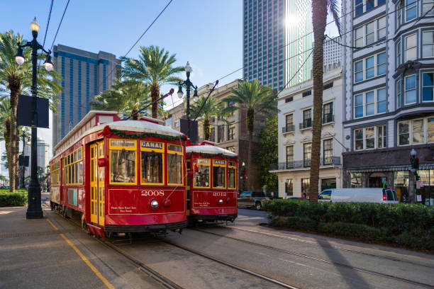New Orleans Street Cars in Canal Street New Orleans Street Cars in Canal Street french quarter stock pictures, royalty-free photos & images