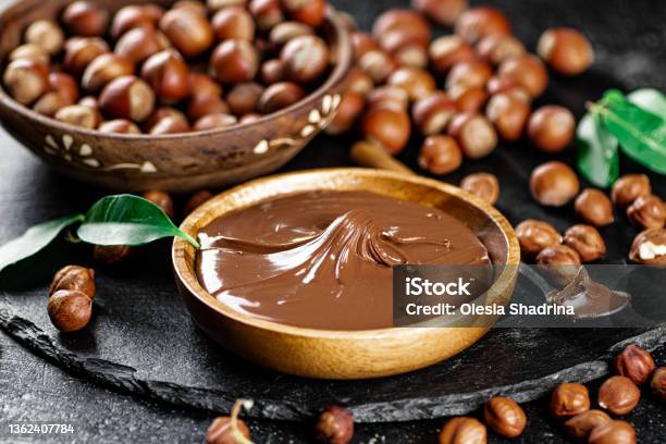 Hazelnut Butter On A Stone Board On A Plate And In A Spoon Stock Photo - Download Image Now