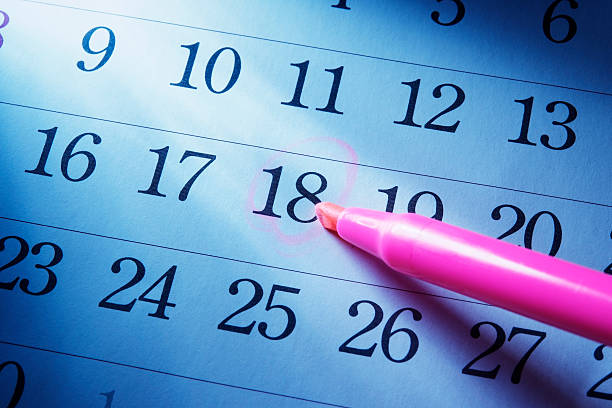 istock Blue tinted image of setting a date on calendar 136242222