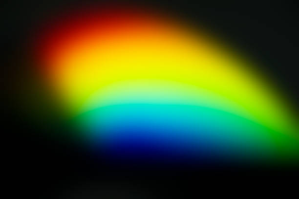 istock Red, yellow, green and blue blot on black background. 1362422373