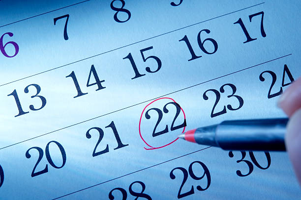 istock Hand writing a red round mark of a calendar 136242244