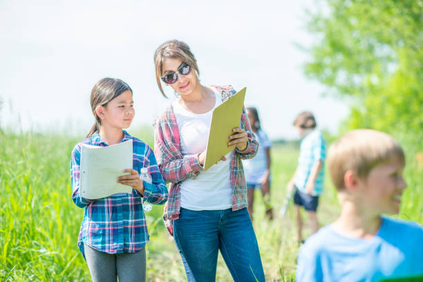 istock Comparing Results of an Outdoor Science Class 1362423386