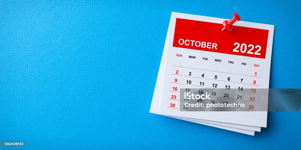White Sticky Note With 2022 October Calendar And Red Push Pin On Blue Background 2022 Stock Photo