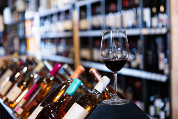 istock Red wine glass in wine store interior 1362430362