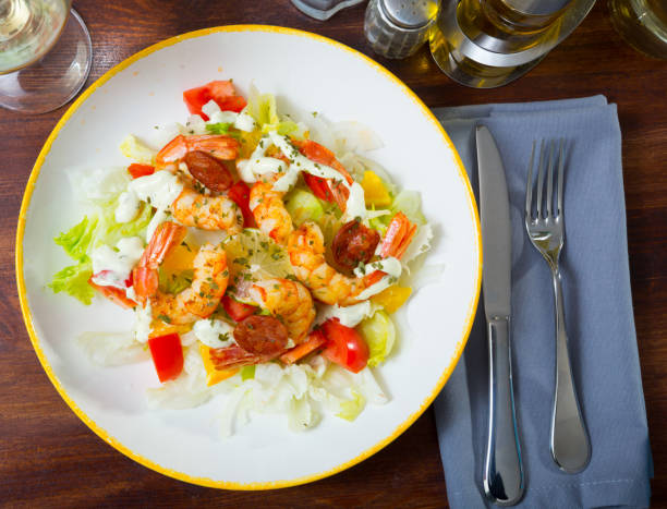 istock Shrimps, chorizo sausages and vegetables 1362430389