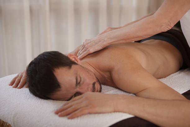 istock Mature man getting professional massage 1362432628