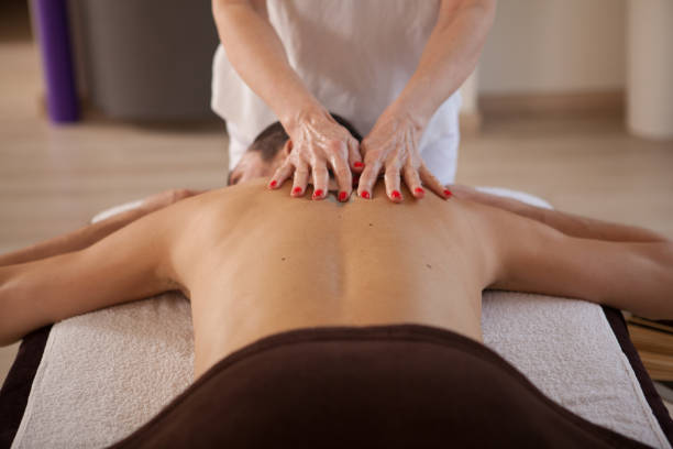 istock Mature man getting professional massage 1362432630