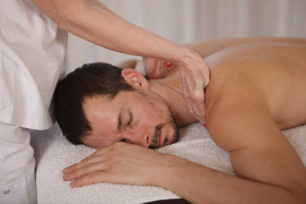 istock Mature man getting professional massage 1362432631