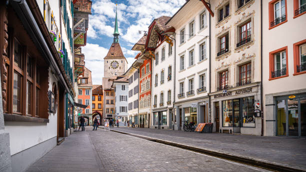 A pedestrian street in  the downtown of the city Aarau Aarau, Switzerland - April 11, 2021 - A pedestrian street in  the downtown of the city Aarau, the capital  of the canton of Aargau in a spring weekend day aargau canton photos stock pictures, royalty-free photos & images