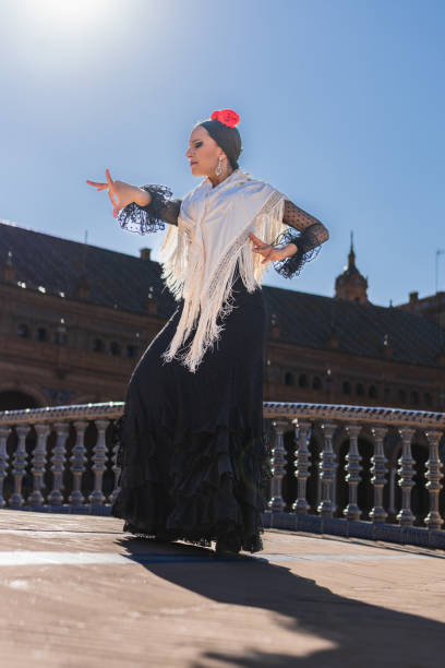 istock Flamenco dancer illuminated by the sun while dancing outdoors 1362442035