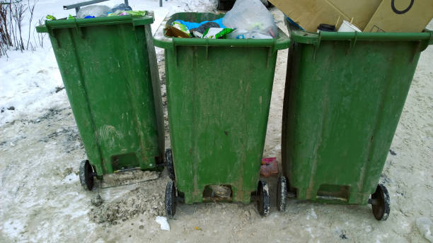 istock Waste in trash container and garbage in the city. Problem of cleaning, cleanliness and environmental protection. Messy. Real life. Recycling rates. Household recycling. 1362444977