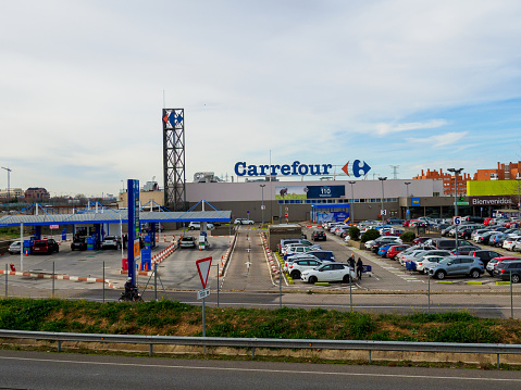 Alcala de Henares, Spain; 2th January 2022: Front View of carrefour supermarket with Parking and fuel station.